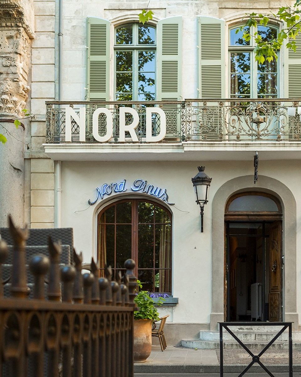 Façade of hotel Le Nord-Pinus in Arles, France.
